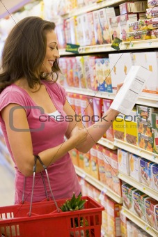 Woman checking food labelling
