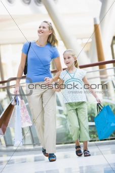 Mother and daughter shopping in mall