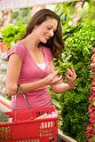 Young woman shopping for produce