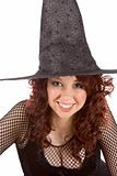 Smiling read head teen girl in Halloween hat