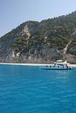 Exotic beach with perfect waves and boats on Lefkada Island in Greece