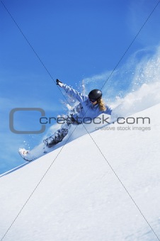 Young woman snowboarding