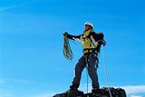 Mountaineer on top of mountain summit