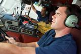 A firefighter driving a fire engine