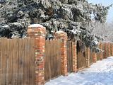 wooden fence with snow