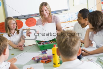 Schoolchildren and their teacher in an art class