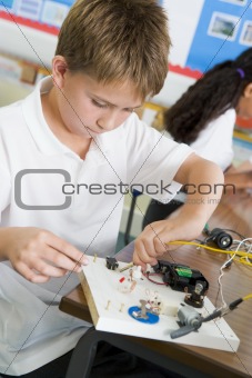 A schoolboy in a science class