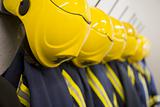 Firefighter's coats and helmets hanging up in a fire station