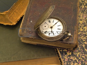 old books and clock