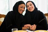 Two Middle Eastern women enjoying a meal 