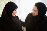 Two Middle Eastern women talking together
