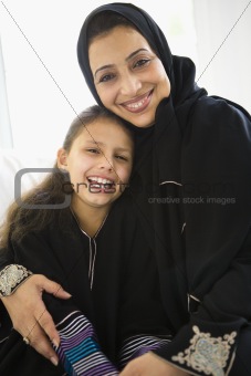 A Middle Eastern woman with her granddaughter
