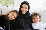 A Middle Eastern woman with her children
