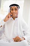 A Middle Eastern man talking on a mobile phone