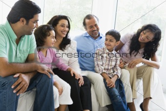 A Middle Eastern family sitting together on a couch