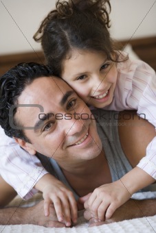 A Middle Eastern man with his daughter