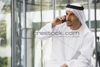 A Middle Eastern businessman talking on a mobile phone