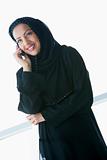A Middle Eastern businesswoman talking on the phone