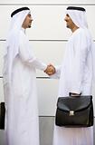 Two Middle Eastern businessmen shaking hands