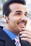 Businessman using bluetooth earpiece