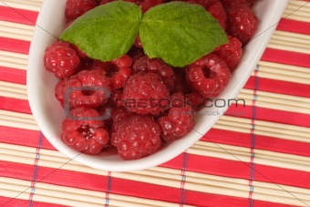 Raspberries and Leaves on a Plate