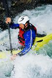 Man kayaking in rapids