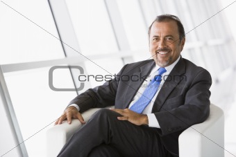 Businessman relaxing in lobby