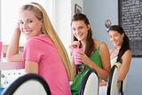 Young women drinking milkshakes in a cafe
