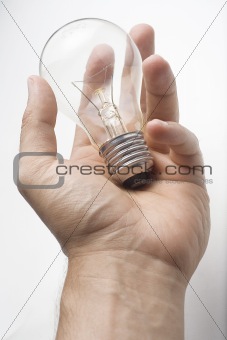 human hand offer a bulb light