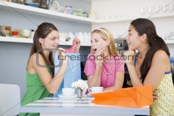 Young women enjoy tea in a cafe