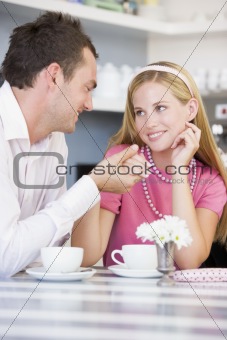 A young couple enjoying tea together