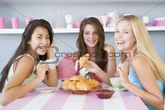 Three young women in their underwear having a tea party