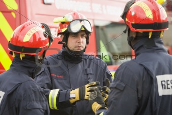 A firefighter giving instructions to his team