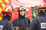 A firefighter giving instructions to her team