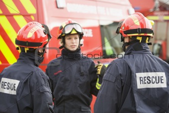 A firefighter giving instructions to her team