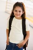 Portrait of kindergarten girl with backpack