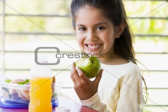 Girl eating lunch at kindergarten 