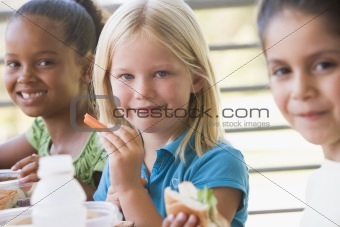 Kindergarten children eating lunch