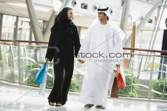 A Middle Eastern couple in a shopping mall