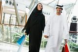A Middle Eastern couple in a shopping mall