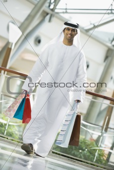 A Middle Eastern man in a shopping mall