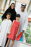 A Middle Eastern family in a shopping mall