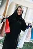 A Middle Eastern woman in a shopping mall