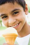 Young boy eating ice cream cone