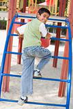 Boy on climbing frame