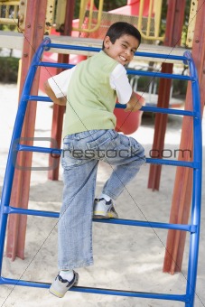 Boy on climbing frame