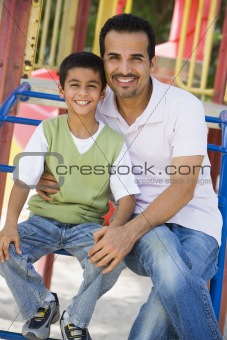 Father and son in playground
