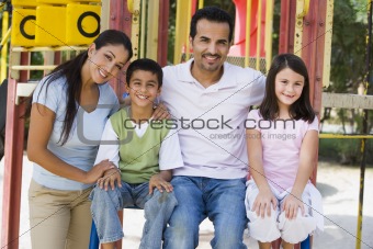 Family having fun in playground