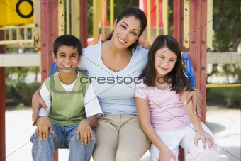 Mother and children in playground
