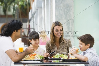 Family enjoying lunch at cafe